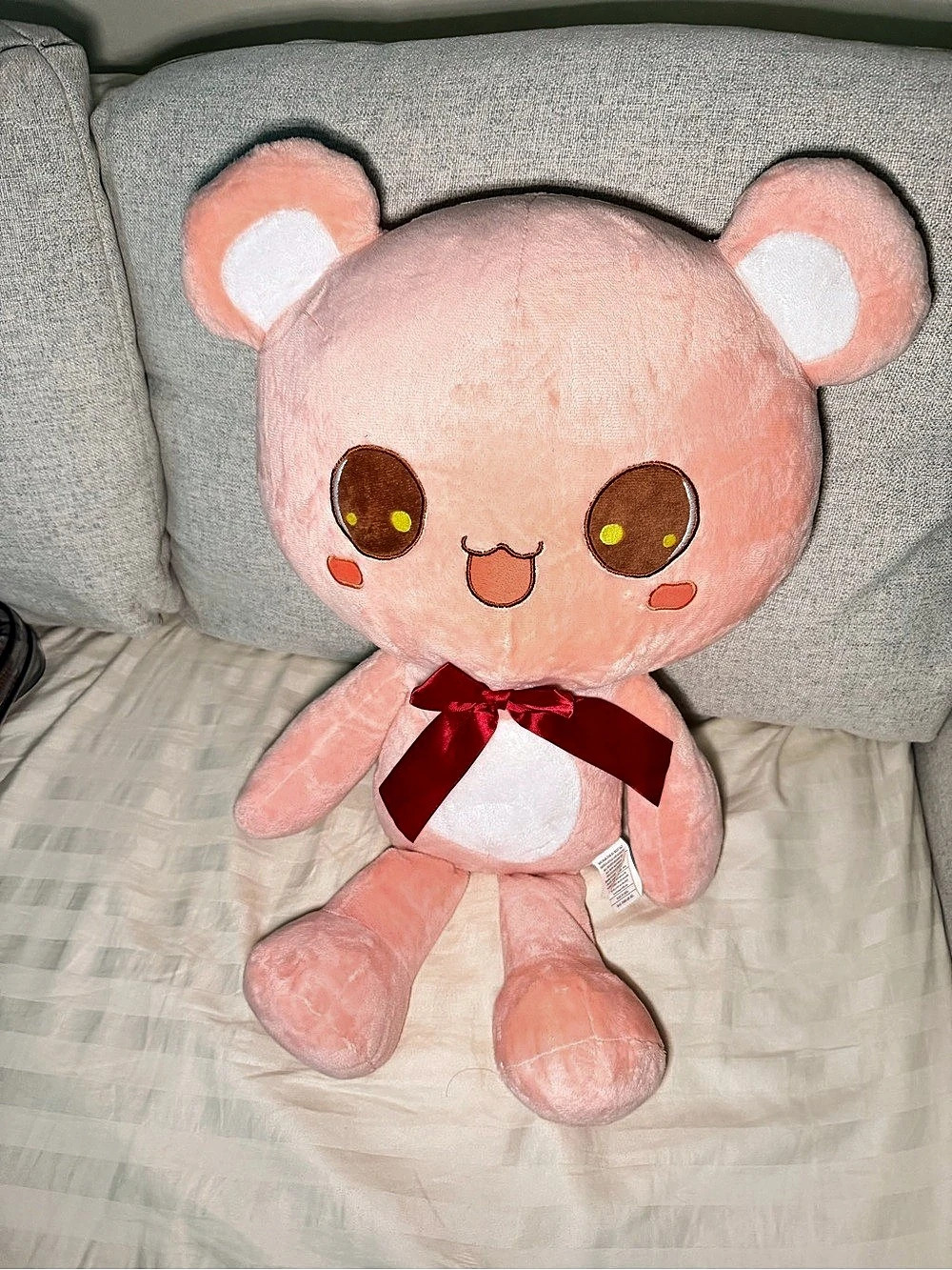 Pink Plush Toy with Red Bow